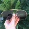 saline.com.br oculos de sol brenda dourado com a lente preta 2